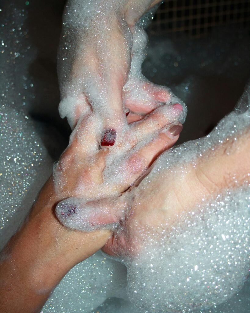 Two people holding hands in a bubble