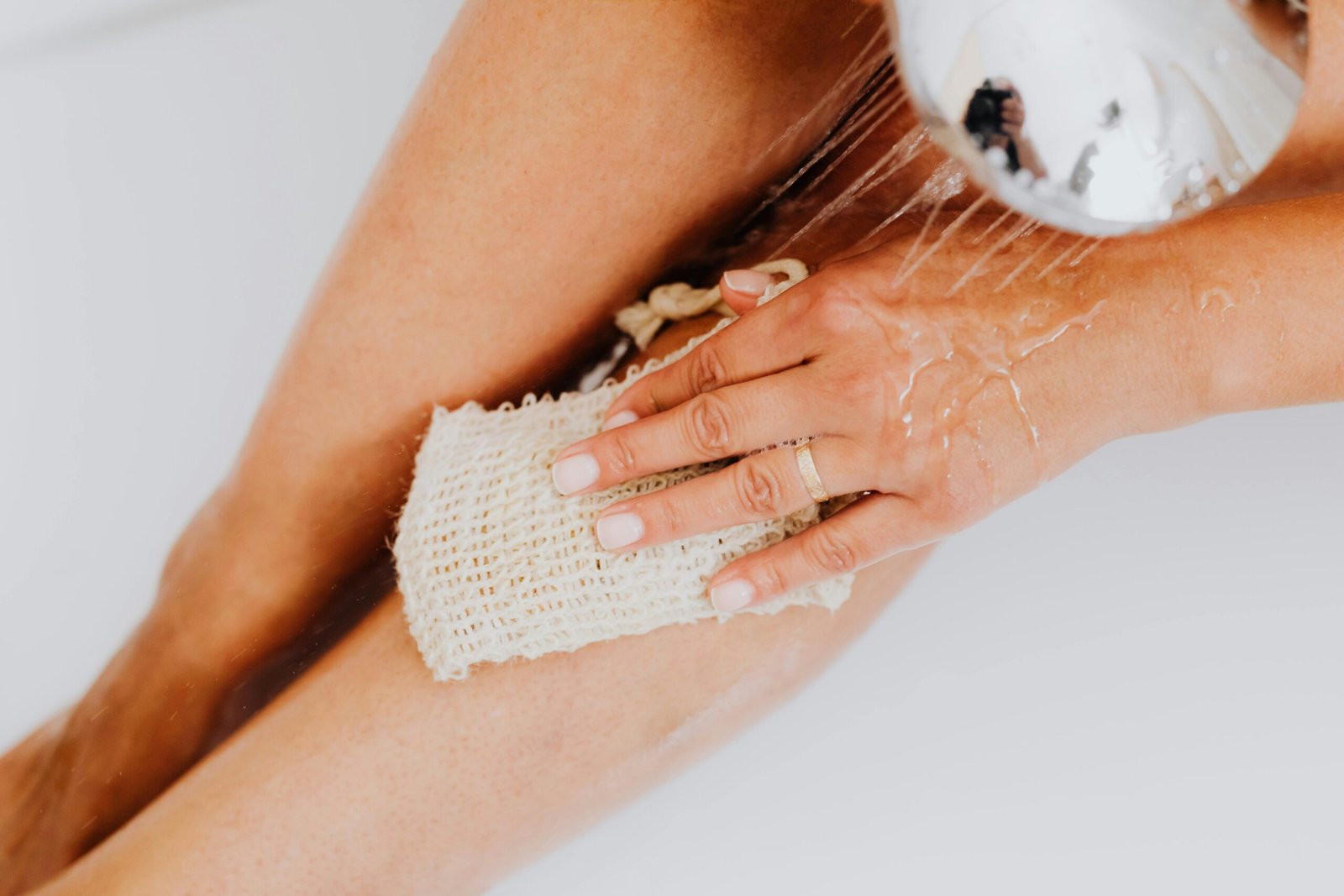 A woman scrubbing her leg