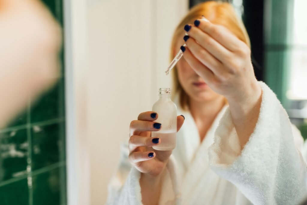 A woman holding retinol serums