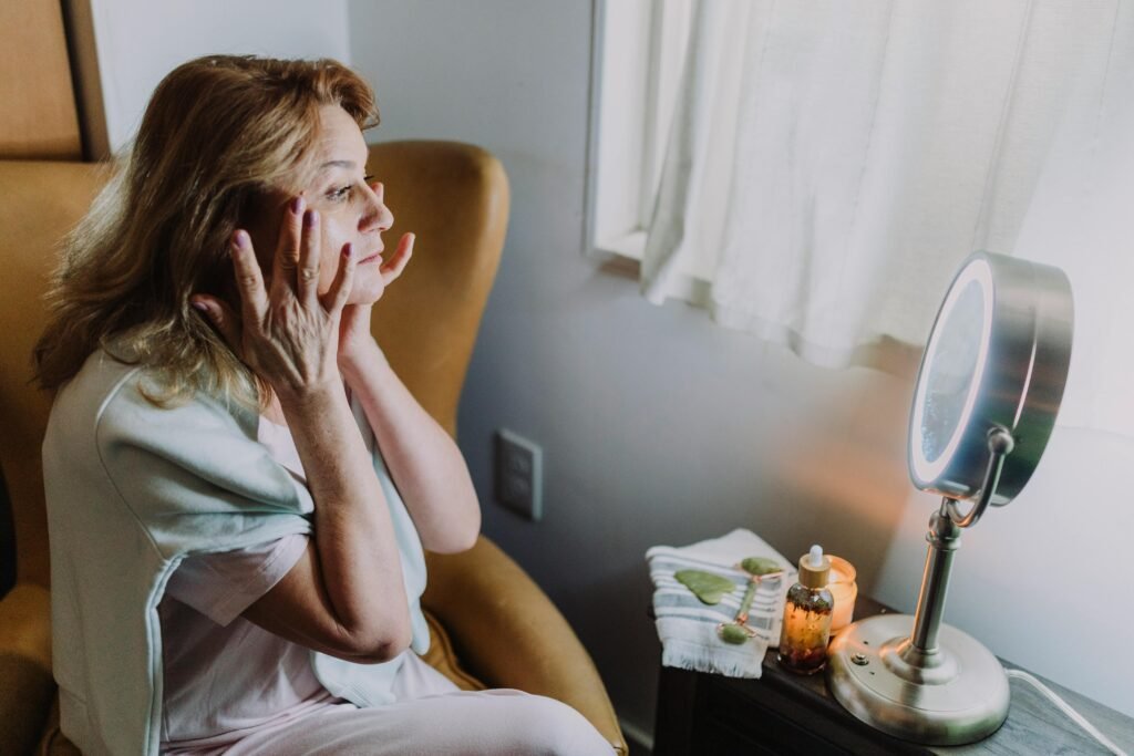 A woman applying a face toner in her skincare routine