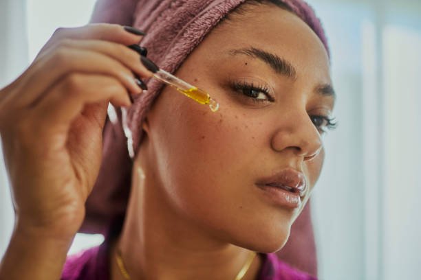 A woman using facial oils