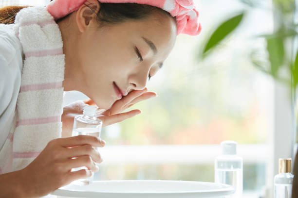 A woman using a korean oil cleansers