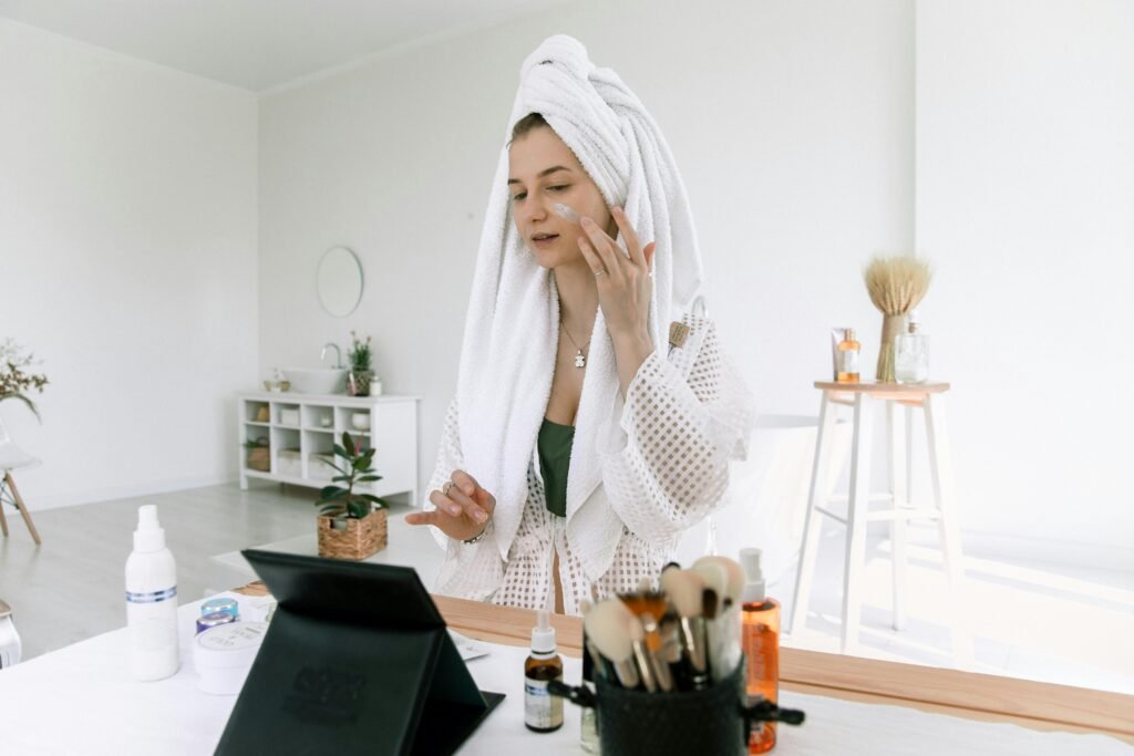 Woman applying products on Her face