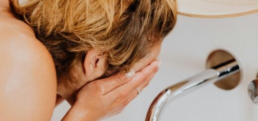 A woman washing her face
