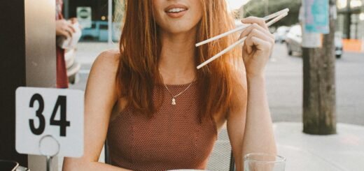 A woman sitting with food in front of her