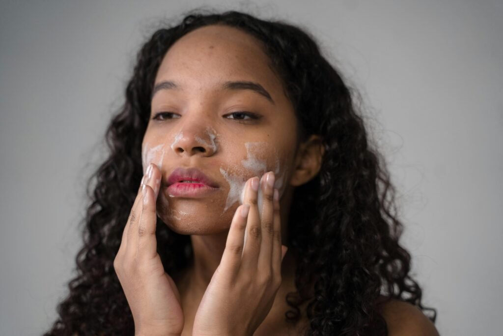 A woman using a glycolic cleanser