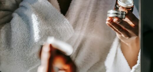 A person holding a moisturizer