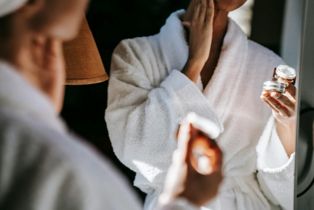 A woman holding ceramide in moisturizer