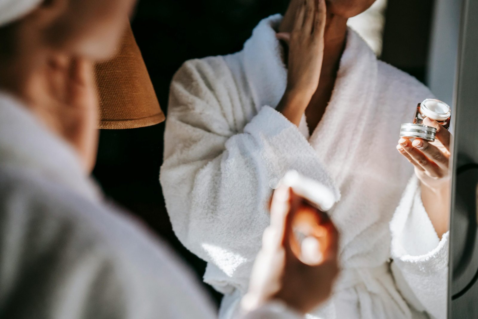 A woman using ceramides in moisturizer